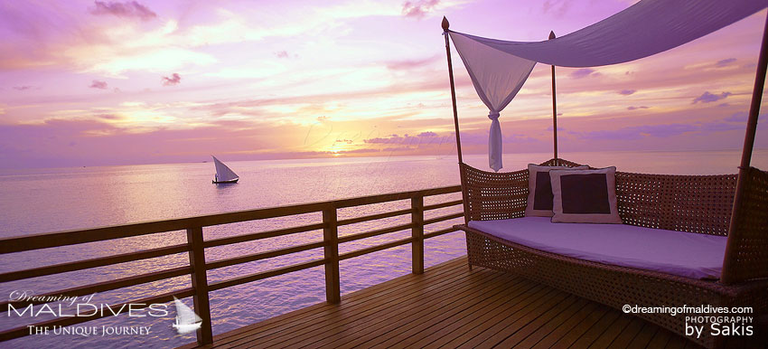 Sunset from one of Baros Maldives water Villa
