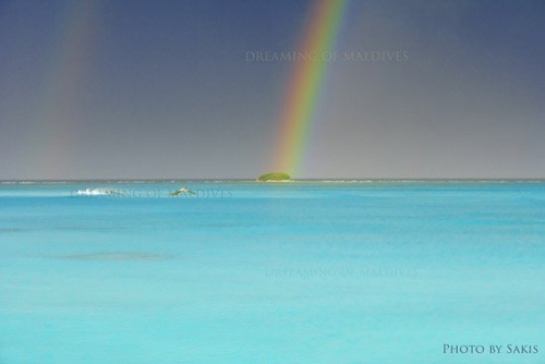 Rainbow over an island in Maldives