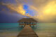 coucher de soleil et arc en ciel maldives pendant saison pluies