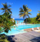 Coco Privé Private Island Maldives The infinity pool and the dolphins seen from the entrance