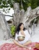 Jacqueline Bourbon at Soneva Fushi with a traditional Tibetan Bowl for Sound Healing.