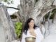 Jacqueline Bourbon at Soneva Fushi with a traditional Tibetan Bowl for Sound Healing.