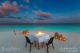 rbeautiful photo of a romantic sunset beach dinner at kandolhu maldives