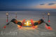 Romantic dinner at a table dug in the sand at Velassaru Maldives