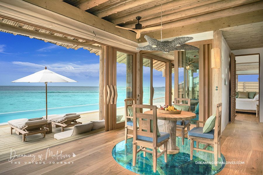 Living-room with a Lagoon View in the 1 Bedroom Water Retreat with Slide Photo Soneva Fushi