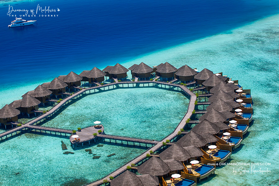 View of Baros Maldives water villas and house reef aerial view