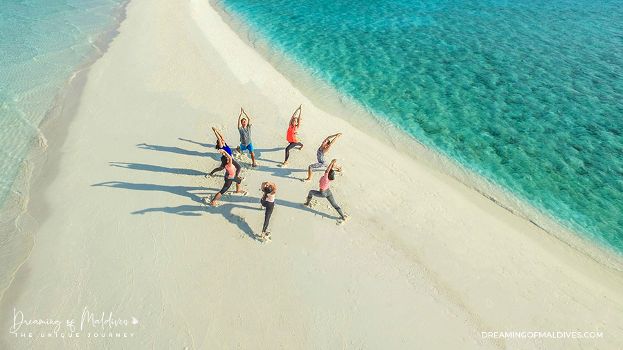 best maldives yoga free group session at one&only reethi rah sandbank beach
