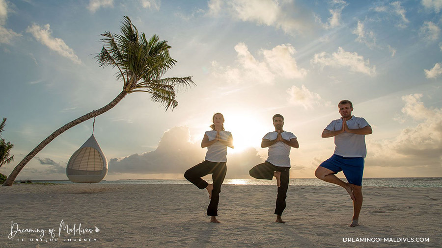 Yoga on the beach at Hideaway Maldives