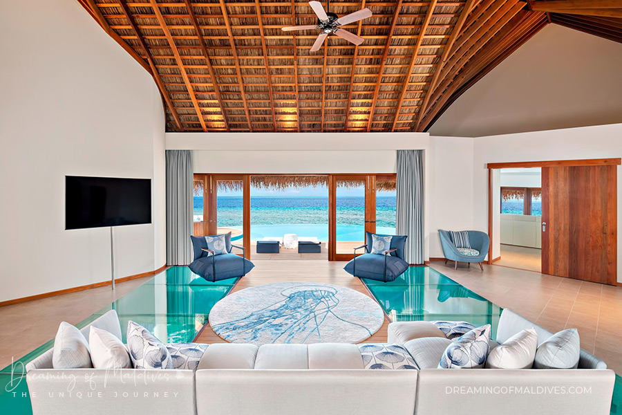 W maldives interior design Sea inspired rug and glass bottom floor in the in the Wow Ocean Haven