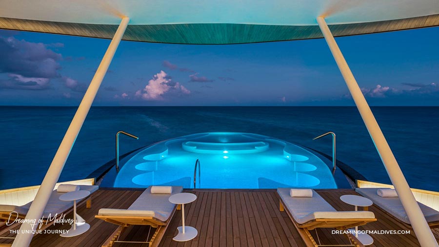 The Amazing Blue Hole Pool at night. Iridium Spa St Regis Vommuli Maldives