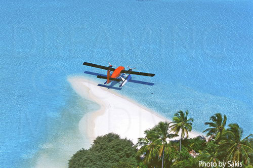 Aerial photography Maldives- Zoom on a seaplane anchored on a desert island