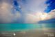 summer monsoon Maldives double rainbow localized rain shower