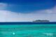 Two waterspouts forming over small islands