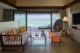 pullman maldives ocean pool suite living room with glass bottom floor
