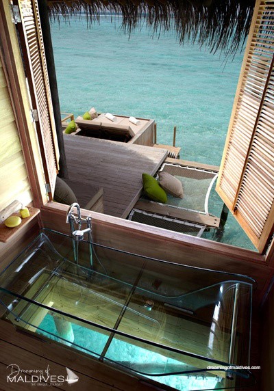 Six Senses Laamu water villa bathroom Sunken ocean view all-glass bathtub