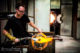 Artist blowing glass at SO Glasscycle studio soneva maldives