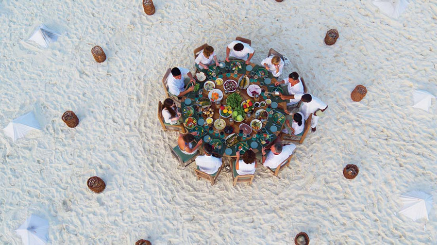 Soneva Fushi Dinner with friends on The resort Sandbank