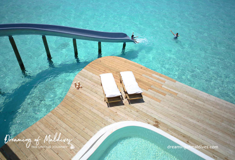 Water villa with water slide at soneva jani maldives resort