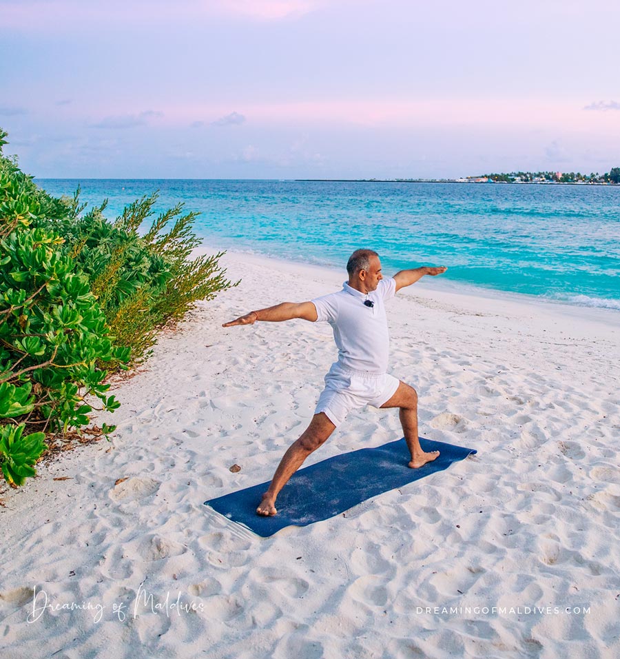 Pawan's Yoga practice on the beach one Soneva Fushi